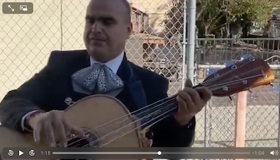 Mariachi Cisneros' rep Juan Cisneros playing Guitarron at Serenata for Maria Image of Mariachi Cisneros' rep Juan Cisneros playing Guitarron