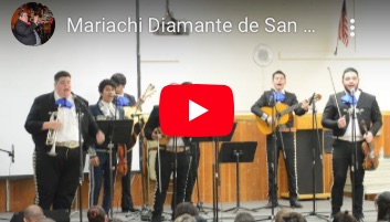 Mariachi Diamante de San Diego "El Gustito" YouTube Video Mariachi Diamante de San Diego "El Gustito" YouTube Video - performing on auditorium stage.