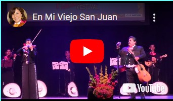 Mariachi Tesoro de Rebecca G. on stage playing "En Mi Viejo San Juan" image of Mariachi Tesoro de Rebecca G. on stage playing "En Mi Viejo San Juan"